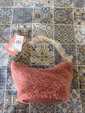cult gaia dusty pink shearling mini bag with gold hardware